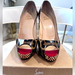 Authentic Christian Louboutin open toe women’s pump with gold spike heel